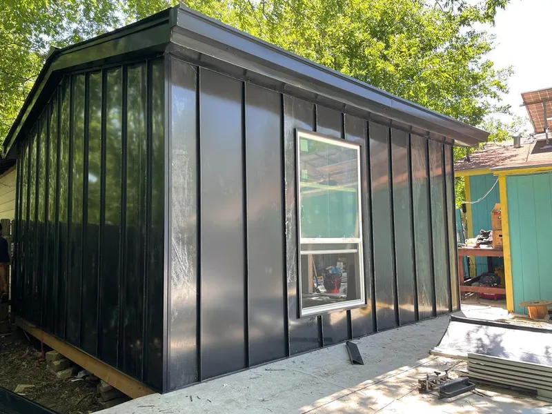 Black standing seam metal wall panels for Roof Inspection in Le Mars